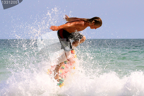 Image of surfer in the wave