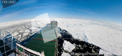 Image of Panoramic shot of a ship navigating in ice.