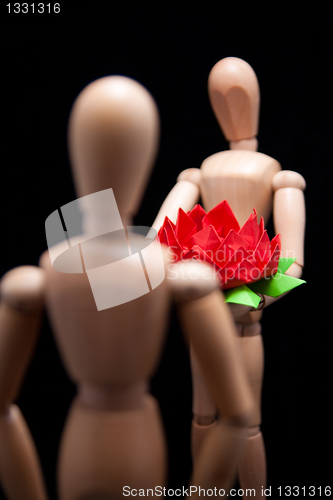 Image of Mannequin giving Flower