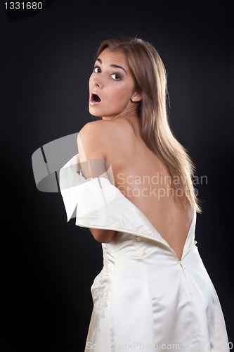 Image of pretty girl with bare back in the studio