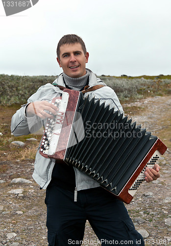 Image of man with an accordion