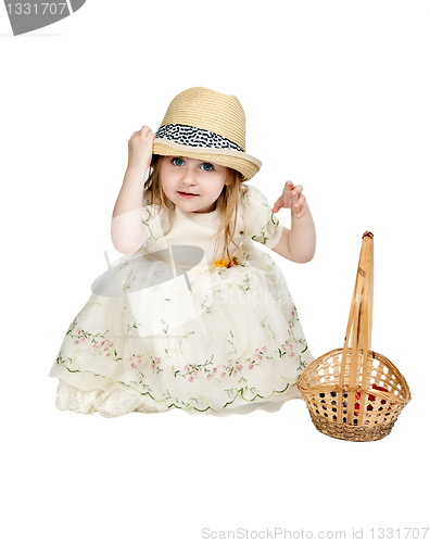 Image of little girl in a straw hat with a basket woven