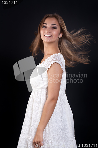 Image of beautiful girl with her â€‹â€‹hair disheveled in the studio