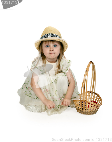 Image of little girl in a straw hat with a basket