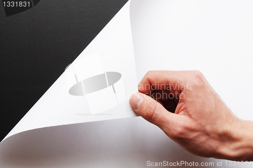 Image of paper and hand