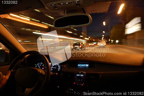 Image of night drive with car in motion 