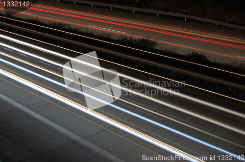 Image of highway at night with traffic