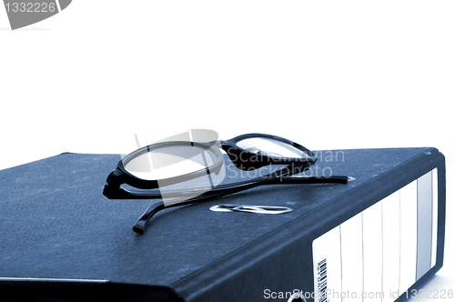 Image of eye glasses and folder