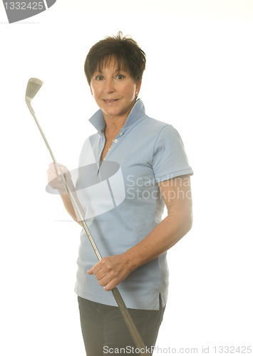 Image of female middle age senior woman athlete with gold iron club