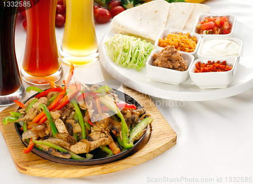 Image of original fajita sizzling hot  on iron plate