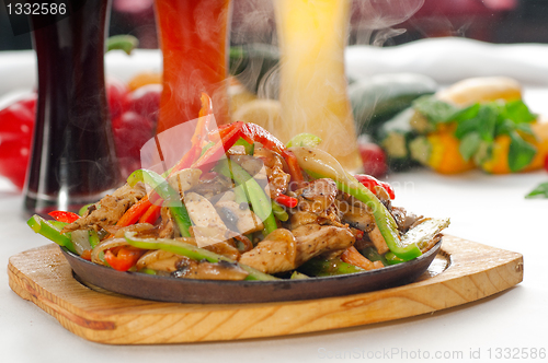 Image of original fajita sizzling hot  on iron plate