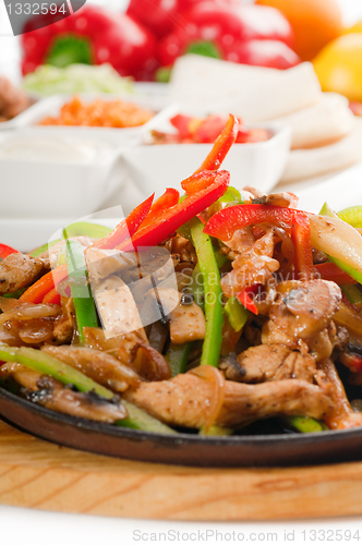 Image of original fajita sizzling hot  on iron plate