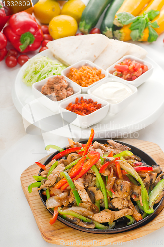 Image of original fajita sizzling hot  on iron plate