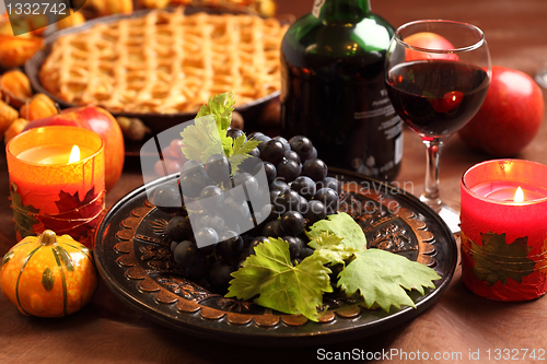 Image of Red grapes and apple pie