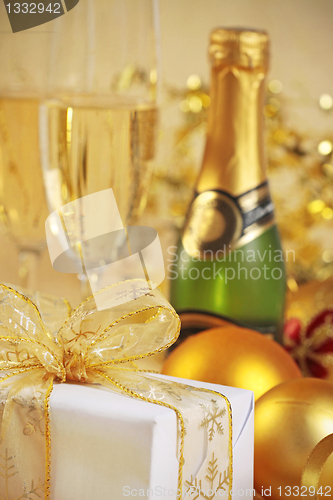 Image of christmas gift and champagne