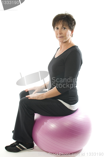 Image of   senior woman fitness exercise with core training ball