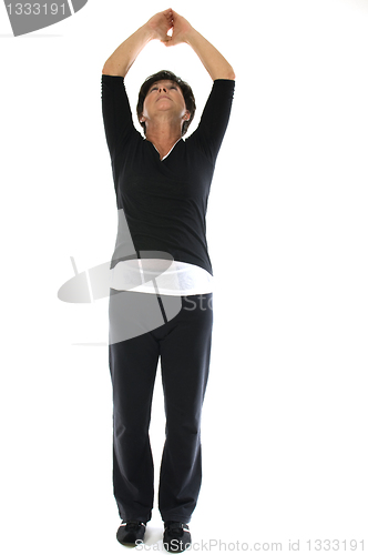 Image of middle age woman demonstrating yoga position mountain tadasana s