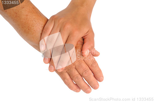 Image of Hands of young and senior women - helping hand concept - clipping path included