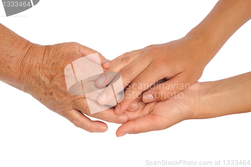 Image of Hands of young and senior women - helping hand concept - clipping path included