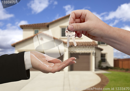 Image of Handing Over the House Keys in Front of New Home