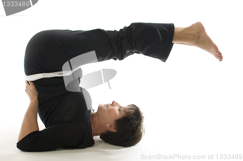 Image of middle age senior woman back stretch yoga position