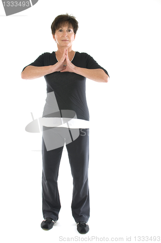 Image of middle age senior woman yoga position stretch