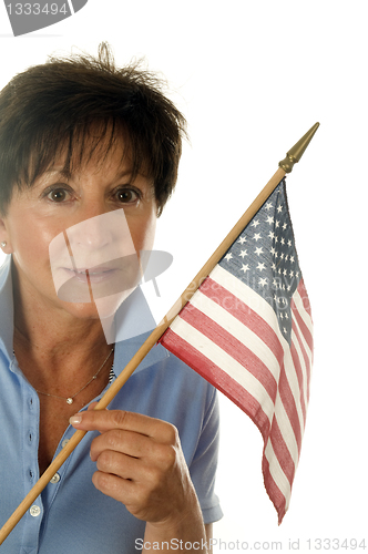 Image of middle age senior woman patriotic with American flag