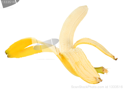 Image of Single yellow banana and peel