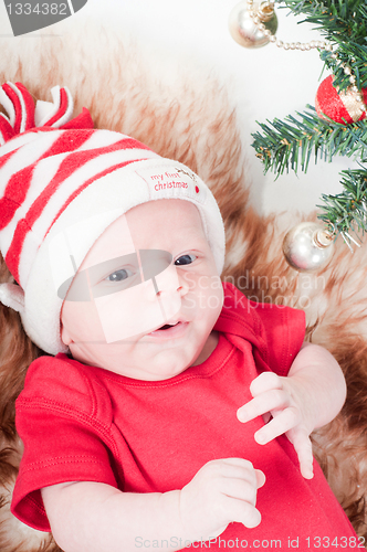 Image of Newborn baby in chritstmas hat