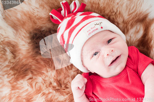 Image of Newborn baby in chritstmas hat
