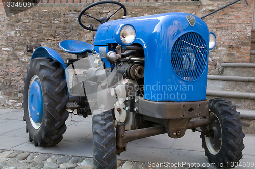 Image of Old model of tractor; renovated to be in superb condition