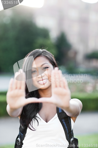 Image of Asian college student making a frame