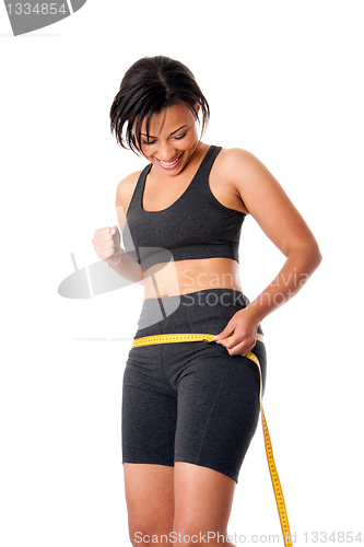 Image of Woman celebrating successful weightloss