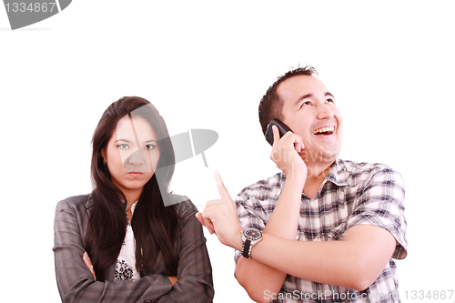 Image of happy man talking on the phone, forgetting about his wife 