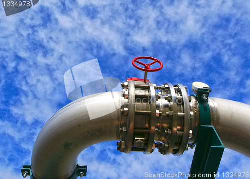 Image of Industrial zone, Steel pipelines and valves against blue sky