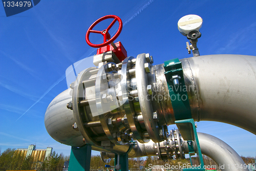 Image of Industrial zone, Steel pipelines and valves against blue sky