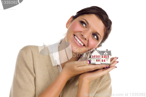 Image of Ethnic Female Daydreaming with Small House on White
