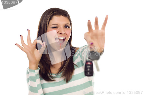 Image of Ethnic Female with Car Keys and Okay Hand Sign on White