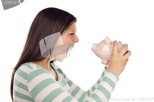 Image of Ethnic Female Yelling At Piggy Bank on White