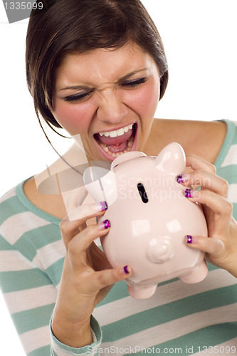 Image of Ethnic Female Yelling At Piggy Bank on White