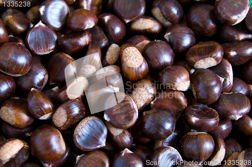 Image of A lot chesnuts waiting to be roasted
