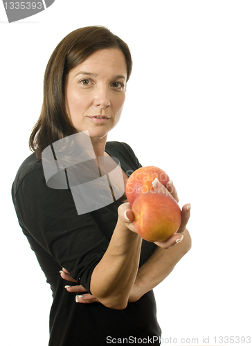 Image of attractive woman with peaches fresh fruit