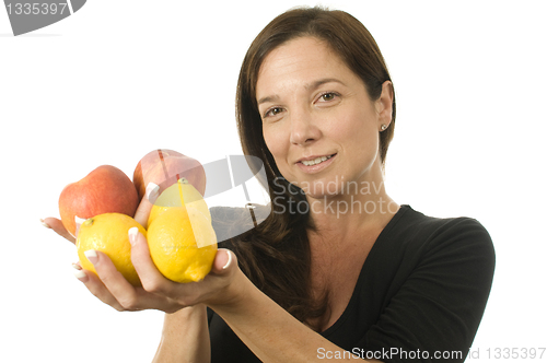 Image of attractive woman with peaches fresh fruit