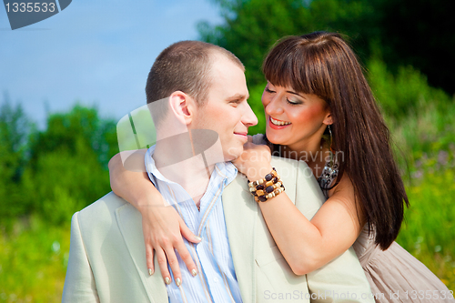 Image of happy enamoured couple embracing