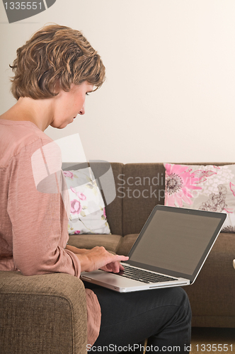 Image of Woman working on a laptop