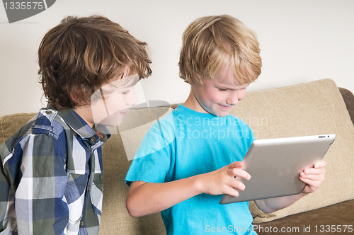 Image of Kid working on a tablet computer