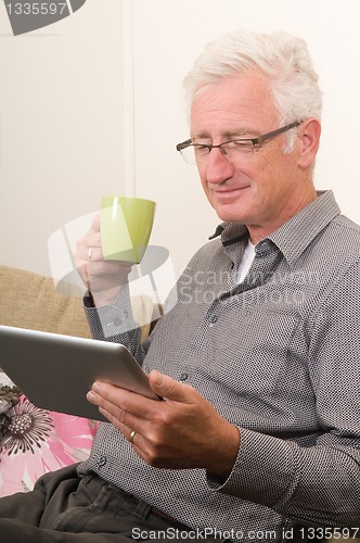 Image of Senior working on a tablet pc