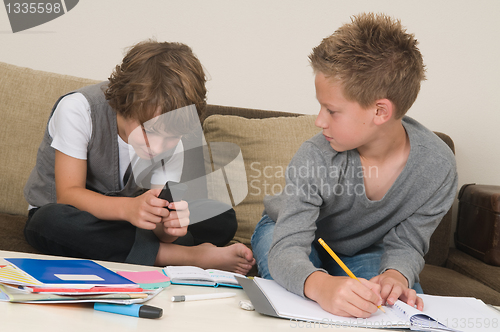 Image of Doing homework while gaming