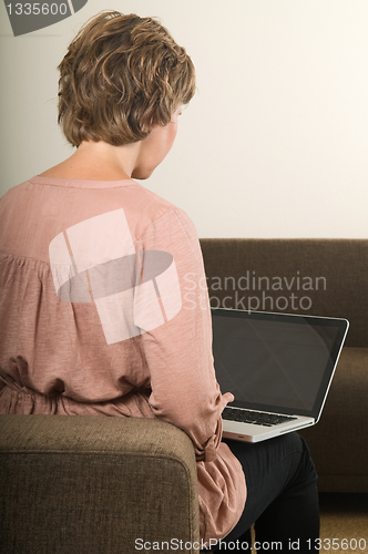 Image of Woman working on a laptop