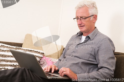 Image of Senior working on a laptop